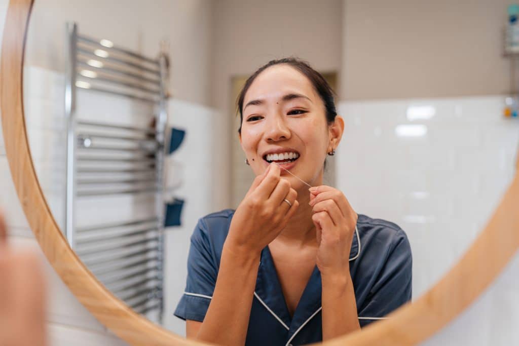 Is It Better to Floss Before or After Brushing? A Dentist Explains