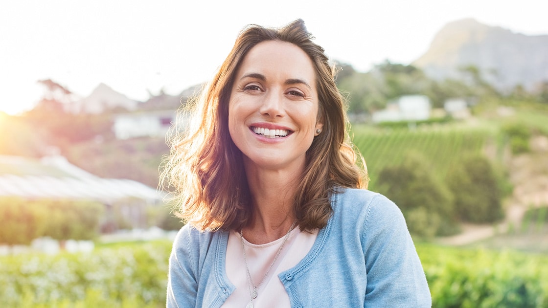 woman smiling outside